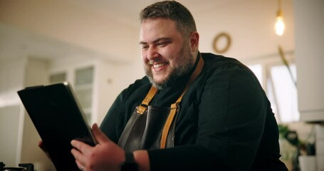 Excited, man and chef with tablet in kitchen, celebration and online with good news for cooking contest. Home, male person and cook with fist pump for digital recipe, culinary success and review - Powered by Adobe