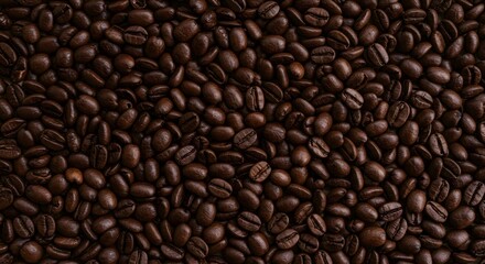Fototapeta premium A detailed capture of roasted coffee beans, offering a textured, rich, and warm visual experience.