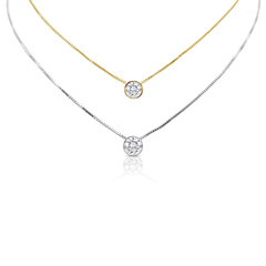 A gold and diamond flower pendant with a silver chain