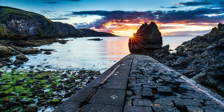 A beautiful sunset at the small harbour of Pettico Wick on St Abb's Head in the Scottish Borders.