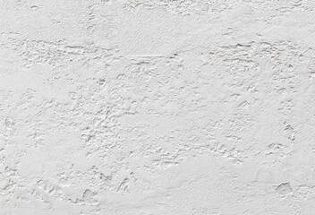 A white wall with a rough texture