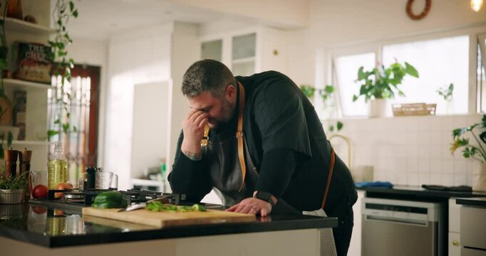 Food, man and headache with cooking in kitchen for burnout, tired and overwhelmed with catering order. Small business, chef and tension migraine in home for startup stress, overworked and pressure