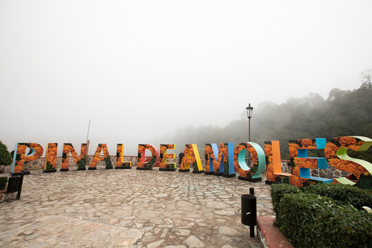 Pinal de Amoles, Quer&eacute;taro, Mexico - November 20, 2022: Fog rolls in behind the famous city letters.