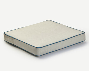 Comfortable square seat cushion resting on white background