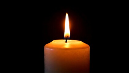 One candle burning slowly isolated on pitch black background
