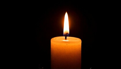 One candle burning slowly isolated on pitch black background