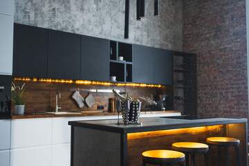 Empty Scandinavian classic minimalistic dark gray kitchen with wooden details. Stylish loft modern...