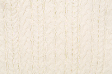 Fototapeta premium White knitted fabric texture as background, top view