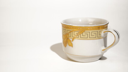 Exquisite White Porcelain Teacup with Delicate Golden Leaf and Geometric Design