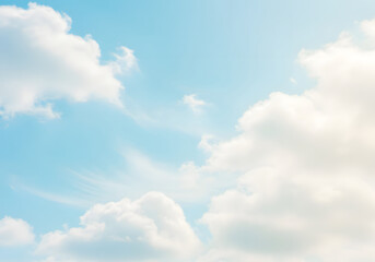 Obraz premium Serene Sky Fluffy White Clouds Against a Bright Blue Background for Nature and Weather.