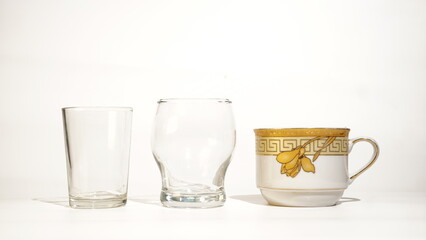 Collection of different drinking vessels, a glass, tulip glass and coffee cup