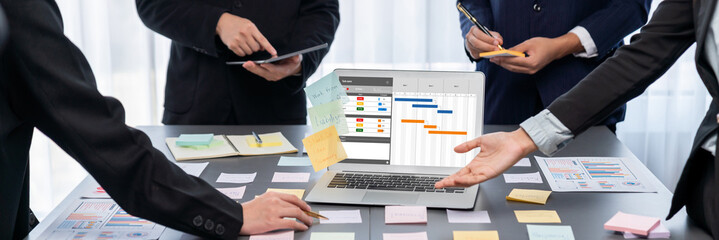 Analyst team use sticky note for creative and analytic brainstorm for business idea with BI data...