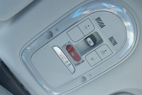 Emergency sos button to contact with call center to ask for help after car accident. SOS button in a car as a symbol for the eCall system in European cars