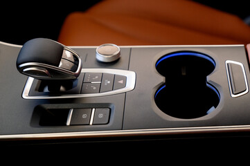 Selector automatic transmission with leather in the interior of a modern car.