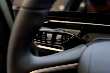 Close up view of car light switch control. Headlight switch, turn signal lever