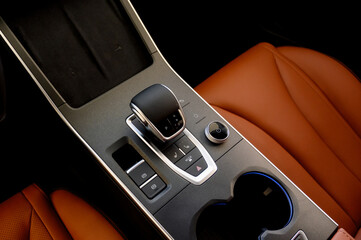 Selector automatic transmission with leather in the interior of a modern car.