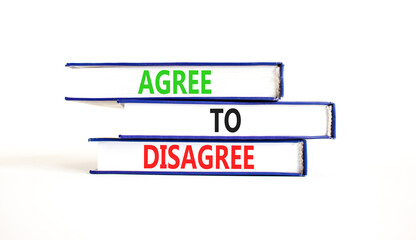 Agree to disagree symbol. Concept words Agree to disagree on beautiful books. Beautiful white paper...