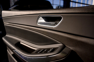 Car door with door handle and window control and adjustment button