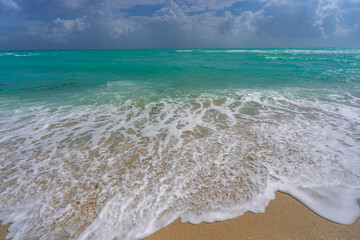 Sea wave. Blue ocean waves. Foamy wave. Rolling sea beach waves. Gentle sea beach wave. Summer sea beach.