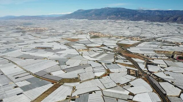 Aerial view of Mar de Plastico, Sea of ​​Plastic, in Almer&iacute;a. A vast expanse of land covered with plastic greenhouses for the production of fruits and vegetables, larger than Almer&iacute;a itself