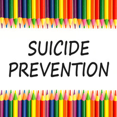 Suicide prevention symbol. Concept words Suicide prevention on beautiful white paper. Colored pencils. Beautiful white paper background. Psychological and suicide prevention concept. Copy space.