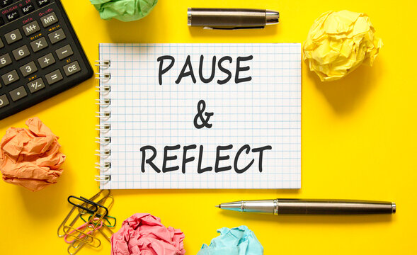 Pause and reflect symbol. Concept words Pause and reflect on beautiful note. Black pen. Calculator. Beautiful yellow background. Business motivational lifestyle pause and reflect concept. Copy space.