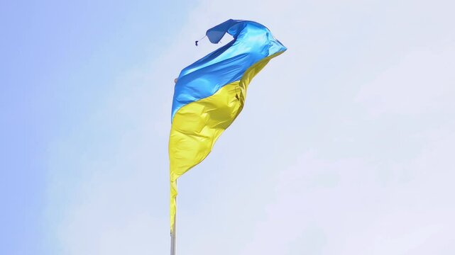 Bright Ukrainian flag in blue sky expressing cultural identity and selfhood