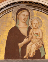 PISTOIA, ITALY - MARCH 16, 2025: The medieval fresco of Madonna in the church Chiesa di San...