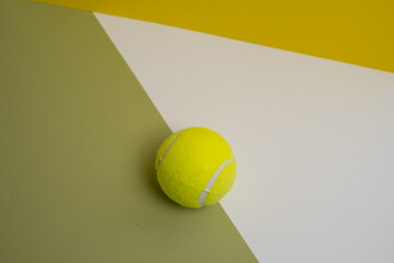 Yellow tennis balls on a colored background. Passing sports