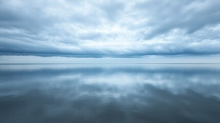 Fototapeta premium Calm, reflective waters mirror a dramatic sky.