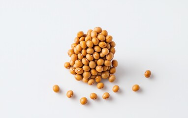 Fototapeta premium Levitation photography of fermented soybeans on a white background. A cluster of soybeans appears to float, with a few scattered around it. The soybeans are light brown. The background is pure