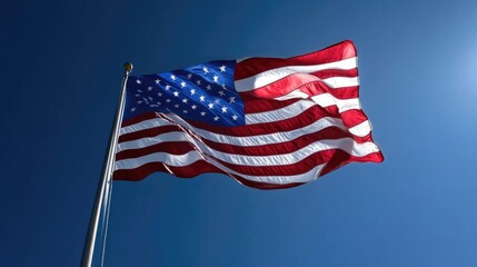 Fototapeta premium American flag waving proudly in the sky