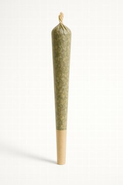A close-up of a pre-rolled cannabis joint, showcasing its cone shape and natural wrapping. ideal for wellness and recreational themes.
