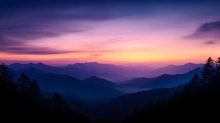 Fototapeta premium A peaceful mountain sunset with pastel colors in the sky and the silhouettes of distant peaks in the background.