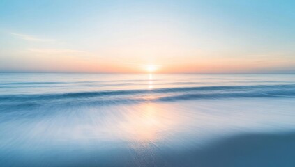 Obraz premium Ocean at sunrise or sunset with blurred motion effect and soft colors.