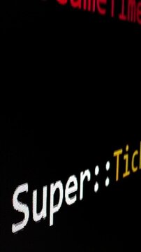 Closeup macro shot movement of coding script moving across LED screen with real-time AI-generated typing, showcasing advanced AI learning in optimization, debug and coding for software development.