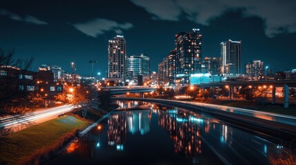 Fototapeta premium A nocturnal cityscape featuring buildings and reflective water features