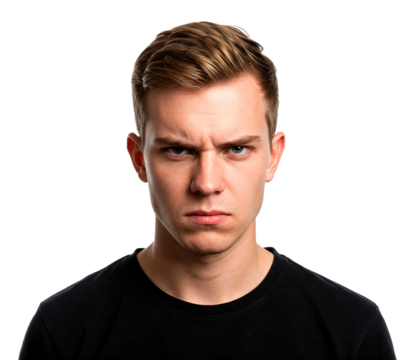 Serious young man scowling with an angry expression. cut out