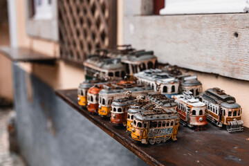 Rusty yellow tram toys from Lisbon, Portugal. 