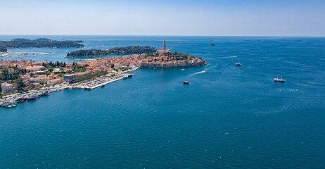 Fototapeta premium Aerial drone view of the sea and islands. High-resolution top-down drone shot of sea, sky, islands and clear sky. Soft lighting ideal for travel, landscape or nature themes.