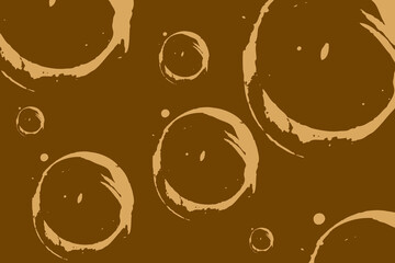 Brown background with abstract bubbles in various sizes creating a textured and artistic design