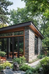 Nestled in the heart of nature, this unique stone building features expansive windows that invite the outside in, creating a peaceful retreat amidst lush greenery, perfect for daytime relaxation