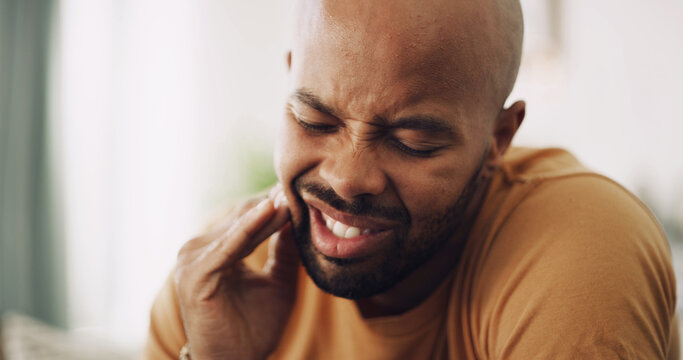 Toothache, pain and man in house with dental problem for cavity, gum disease or gingivitis. Inflammation, dentistry and male person with impacted wisdom teeth for tension, pressure or plaque in home.