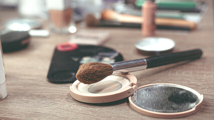 Soft Powder Brush Surrounded by Beauty Essentials