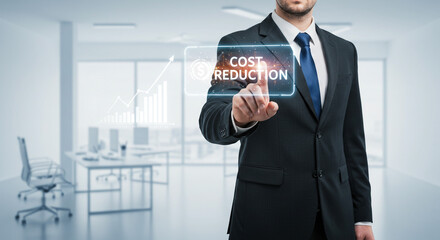 Businessman activates cost reduction strategy on a digital interface with modern office background