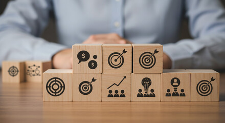 Strategic goals visualized on wooden blocks depicting business targets teamwork and financial growth