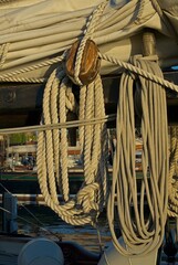 Coiled rope wood block sail on antique sailing ship
