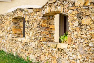 View of a stone brick wall with arched windows in Lower Austria