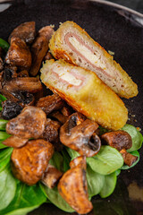 Cordon Bleu Cutlet meat chicken, ham, cheese appetizer dish fresh delicious gourmet food background on the table rustic food top view copy space