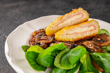 Cordon Bleu Cutlet meat chicken, ham, cheese appetizer dish fresh delicious gourmet food background on the table rustic food top view copy space